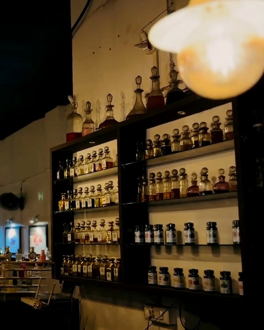 Shelves of essential oil bottles at the SPR Perfume Museum, Mattancherry